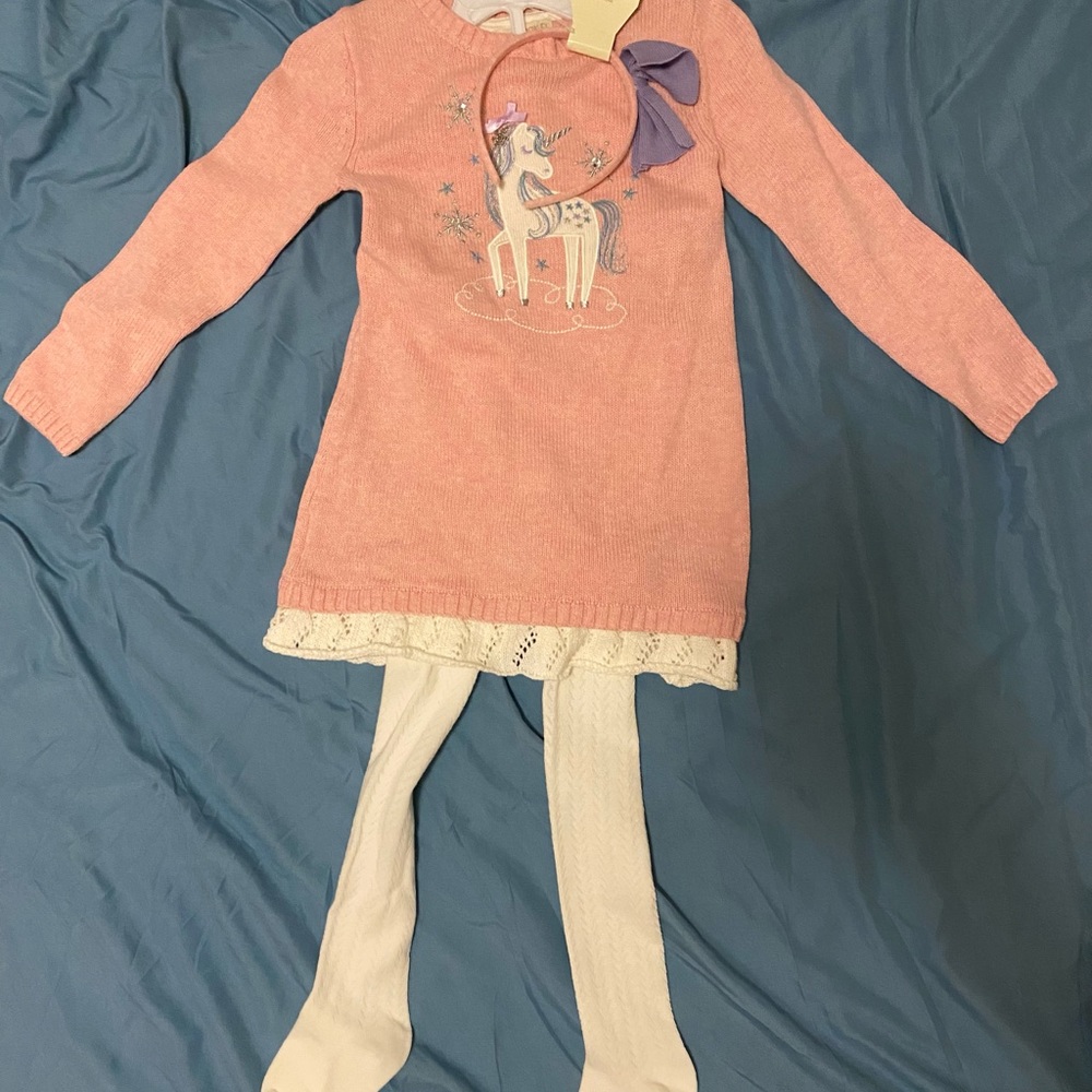 Unicorn sweater dress with tights.